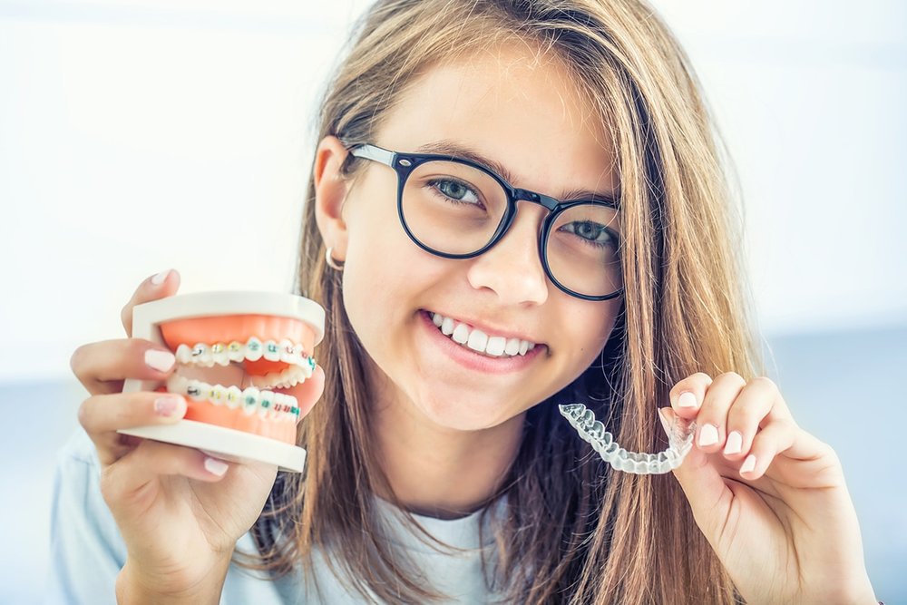 girl with clear aligners